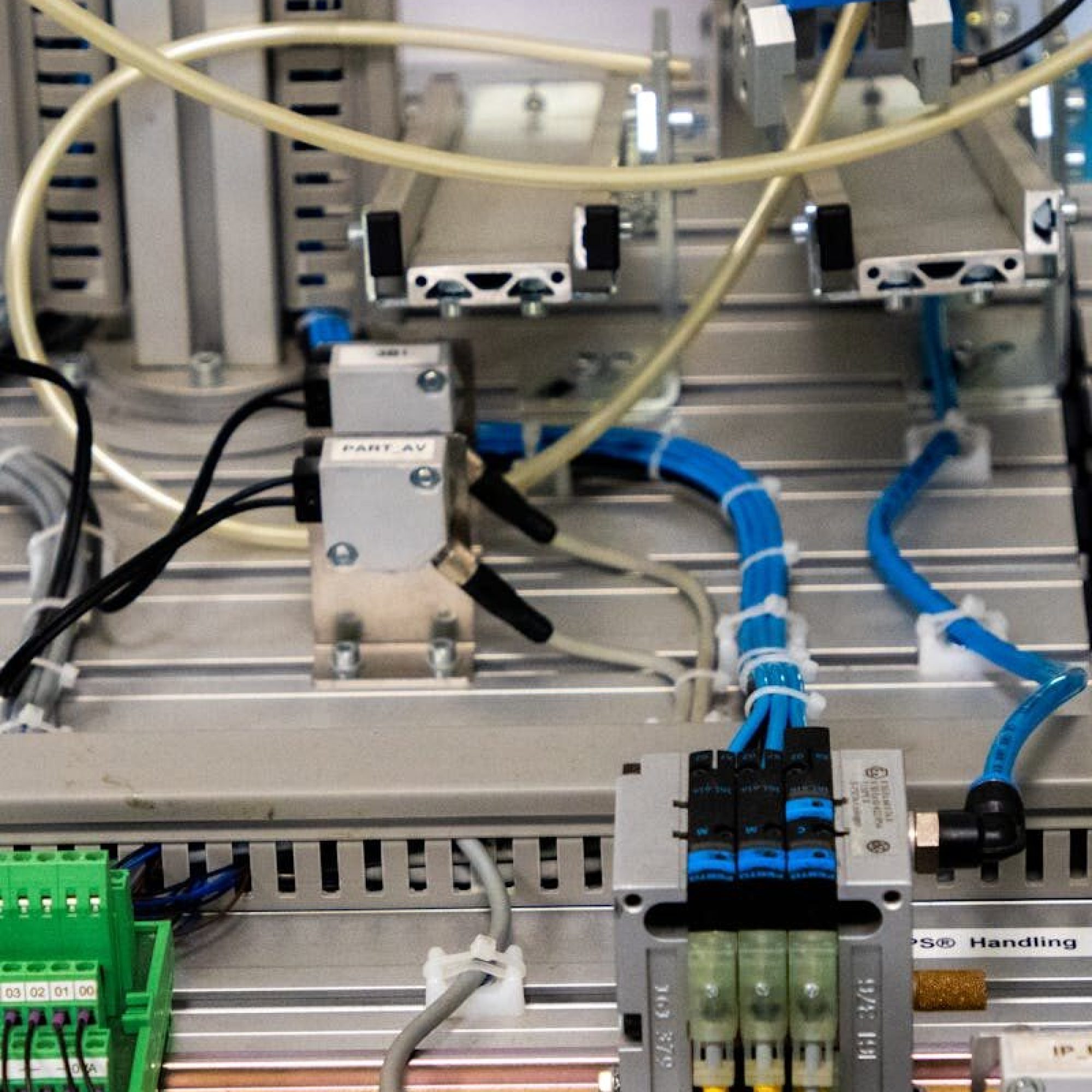 pexels photo 18471565 18471565 Close-up of industrial equipment showcasing electronic wiring and sensors in a manufacturing setup.